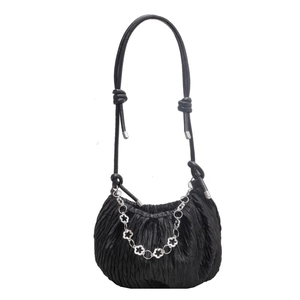 Ruched black shoulder bag with silver floral chain and knotted strap details