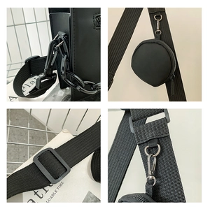 Detail of crossbody bag featuring wide fabric strap, detachable coin purse and matte chain