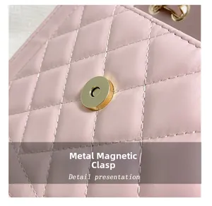 Detail of pink quilted leather bag showing golden magnetic clasp and stitching