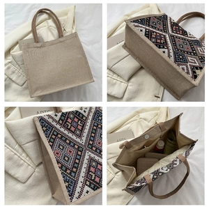 Detail view of ethnic canvas tote bag showing interior zip pocket and magnetic closure