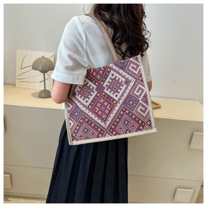Detail of ethnic geometric woven pattern and texture on a large capacity canvas tote bag