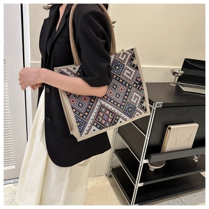 Close-up of geometric ethnic pattern tote bag with thick rope handles and reinforced edges