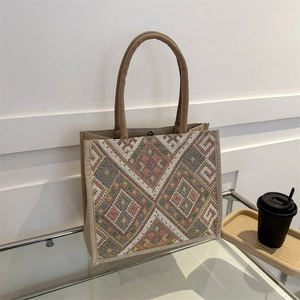 Ethnic style canvas tote bag with colorful geometric woven patterns and sturdy handles