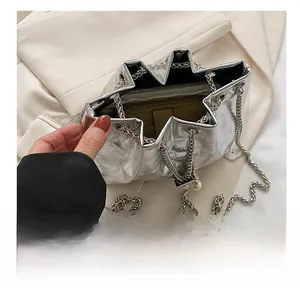 Top view detail of silver star-shaped bucket bag showing capacity for a long wallet