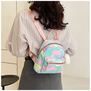 Detailed back view of a mini galaxy backpack with pastel macaron gradients and star prints