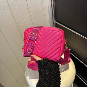 Quilted rose red crossbody bag in nylon with wide strap and detachable coin purse
