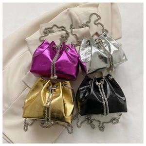 Mini drawstring bucket bags in purple, silver, gold and black with croc texture