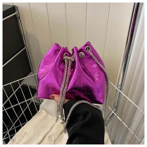 Close-up of purple metallic bucket bag with crocodile texture and pearl chain strap