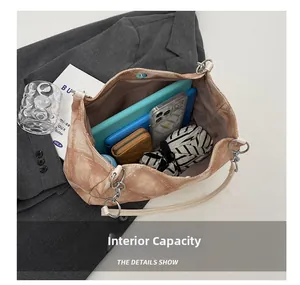 Internal view of brown vintage shoulder bag showing large capacity for essentials