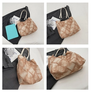 Detail of diamond patchwork tote bag with cream straps and silver ring hardware