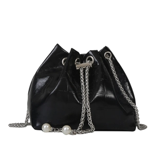 Mini black bucket bag with embossed leather texture, chain strap and pearl accents