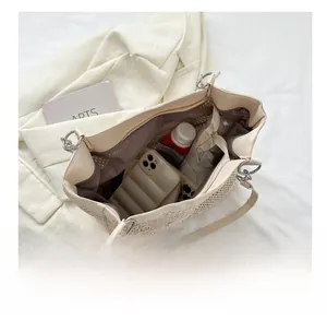Detailed interior of woven beige tote bag showing large capacity for daily essentials