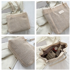 Detail view of woven tote bag showing spacious interior with pockets and durable straps
