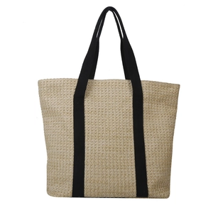 Large straw woven tote bag with black canvas straps, minimalist summer beach handbag