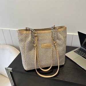 Beige woven large capacity tote bag with khaki leather trim and chain shoulder straps