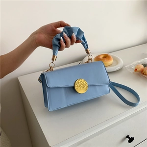 Light blue pleated handle handbag for women with elegant golden ring clasp decoration