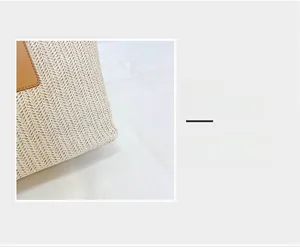 Macro detail of the woven texture and premium leather patch on the straw bucket bag