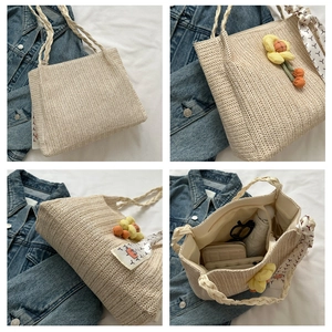 Detailed views of beige straw tote bag with sunflower charm and woven handles