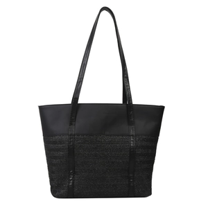 Minimalist black tote bag with leather contrast and woven texture for summer style