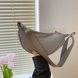 Chic gray nylon crescent shoulder bag for women featuring an adjustable strap for daily use