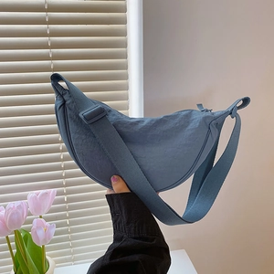 Dark blue nylon crescent crossbody bag with adjustable wide strap for daily casual wear