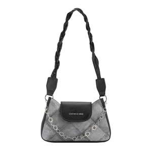 Fashionable grey denim and black leather shoulder bag with chic diamond stitch pattern