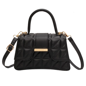 Chic black quilted handbag with gold metal hardware and top handle for women