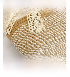 Close-up of woven straw bucket bag showing fine texture and white lace detailing