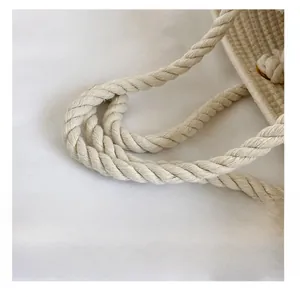 Detail view of thickened cotton rope handle on woven summer bucket beach bag