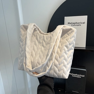 White quilted tote bag with padded weave texture, fashion shoulder bag for daily commuting