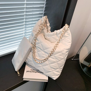 White quilted tote bag set with chain straps and matching small pouch for women