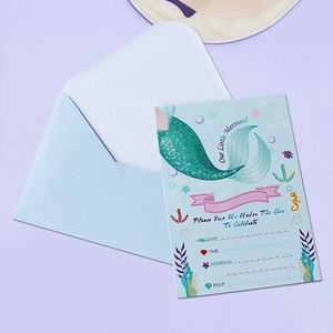 Mermaid party invitations with glitter tails and blue envelopes for kids birthday events
