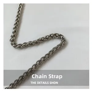 Detail of silver metallic wheat chain shoulder strap for quilted bucket bag