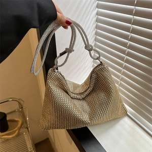 Sparkling gold rhinestone hobo bag with knotted handle for elegant evening party wear