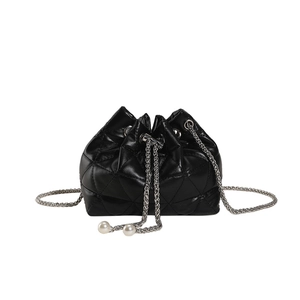 Quilted black faux leather bucket bag with elegant pearl drawstrings and silver chain