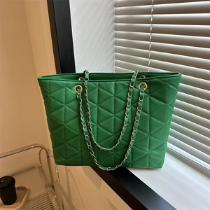 Quilted green PU leather tote bag with gold chain straps and geometric pattern design