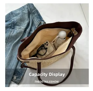 Top view showing large capacity straw tote bag interior with daily essentials and zipper