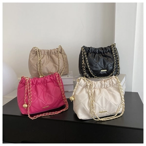 Quilted chain cross-body bags in khaki, black, fuchsia and white with gold accents