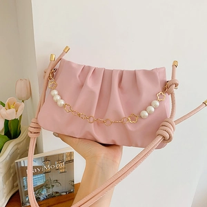 Elegant pink pleated shoulder bag with pearl chain and knot strap detail for women