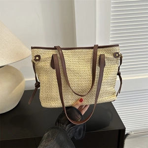 Straw tote bag with brown leather straps for summer casual and beach commuting