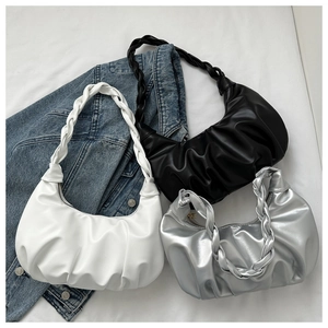 Three pleated crescent bags in white, black and silver with woven handles and zippers