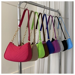 Collection of colorful felt hobo bags with V-shaped stitching and gold chain straps