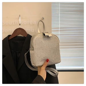 Detail of silver mini backpack with shimmering rhinestones and adjustable straps