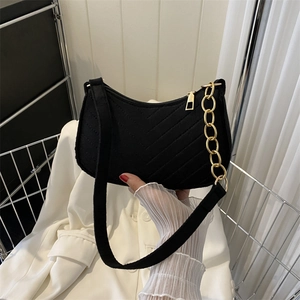 Retro black chevron quilted shoulder bag with a gold chain strap and matte fabric finish