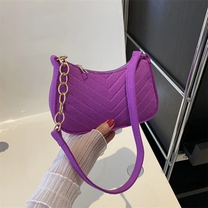 Purple suede baguette bag with V-shaped quilting and gold chain accent for women