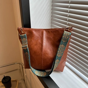 Retro brown PU leather tote bag with a decorative vintage ethnic style wide shoulder strap