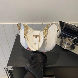 Modern white half-moon bag with gold chain strap and buckle detail for urban fashion