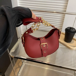 Retro burgundy chain shoulder bag in matte leather featuring a stylish gold link strap
