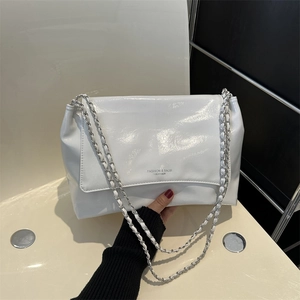 White glossy patent leather shoulder bag with silver chain strap and fashion logo