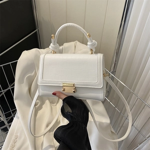 White crocodile pattern faux leather flap bag with gold hardware and knotted handle